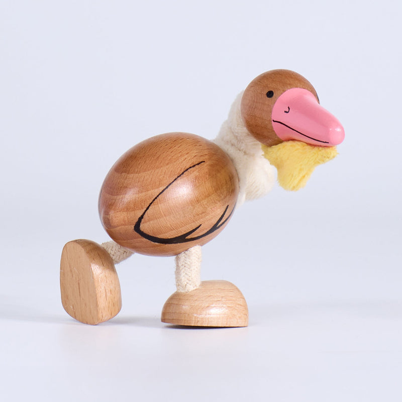 Wooden pelican toy on a white background